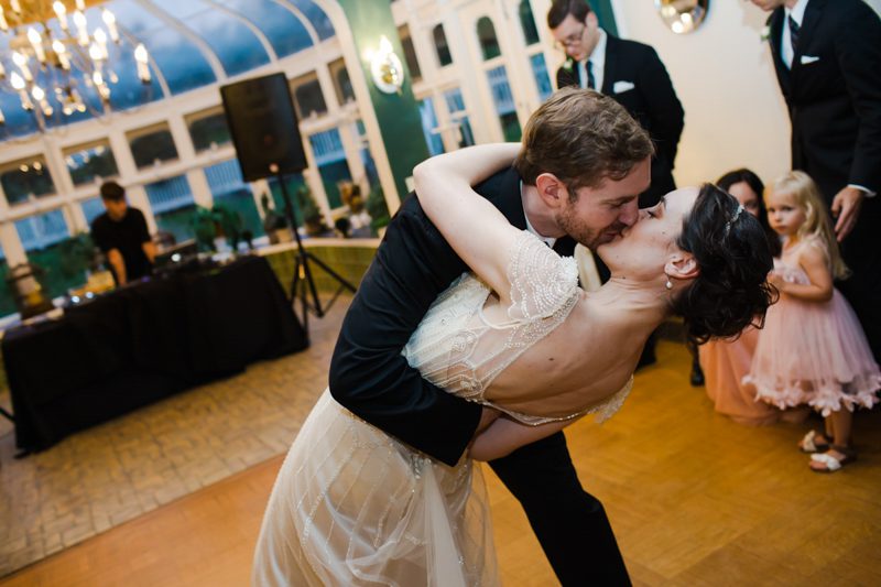 Romance at it's Best art-deco-wedding-groom-dips-bride-for-kiss
